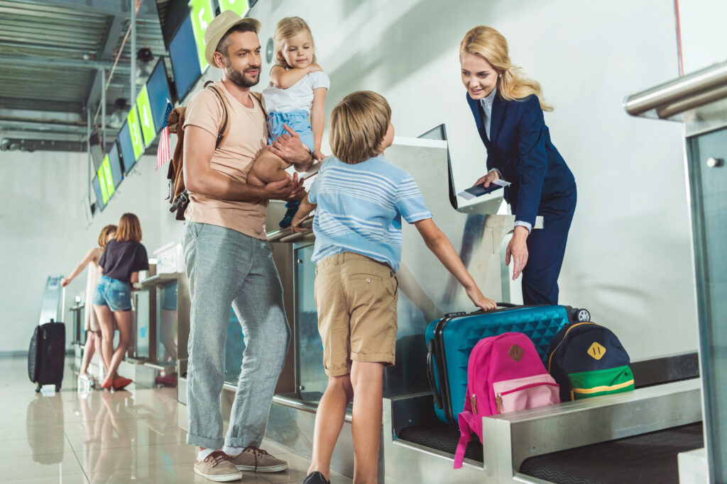 family checking in at airport